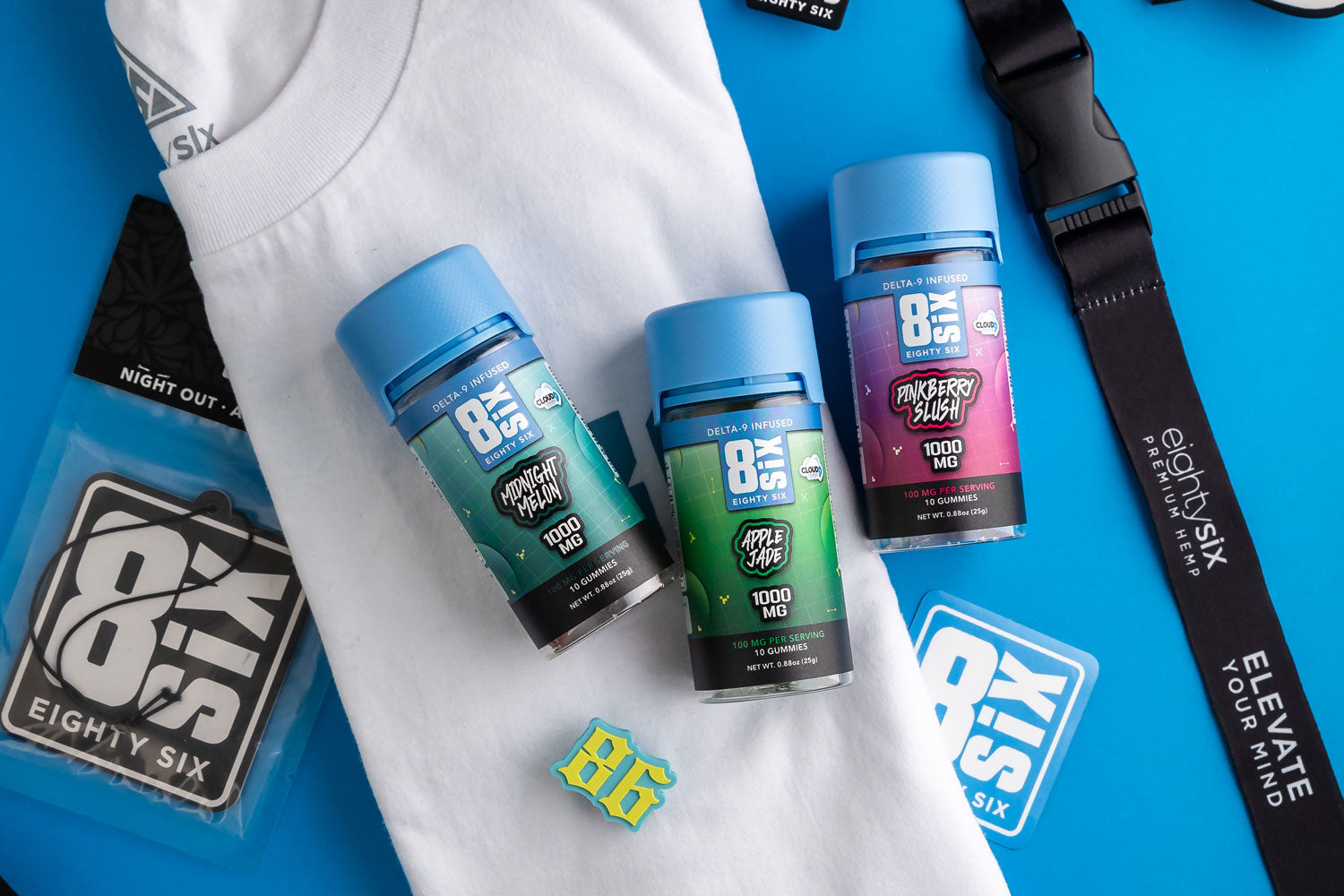 assorted delta 9 gummies on a white t-shirt and blue background