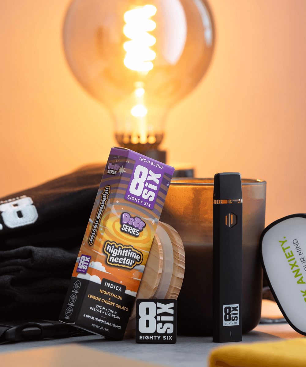 Eighty six products leaning against one another with a lightbulb in the background