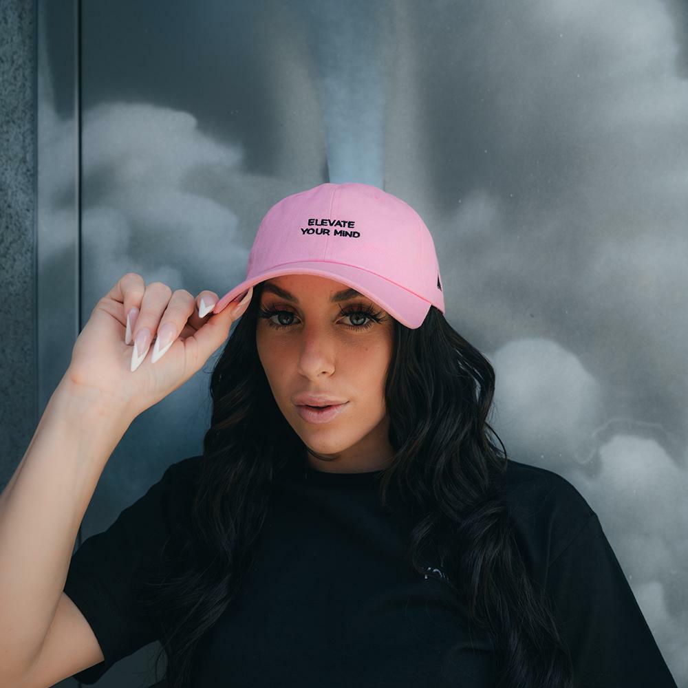 images Woman wearing pink Elevate Dad Hat