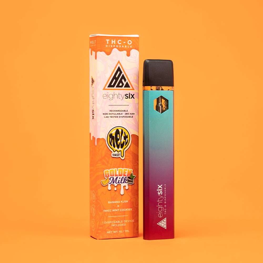 15 Golden Milk THC-O Disposable with its respective box on an orange background.