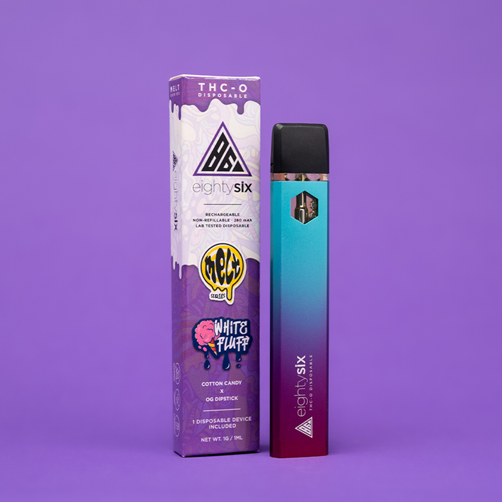 17 White Fluff THC-O Disposable with its respective box on a purple background.