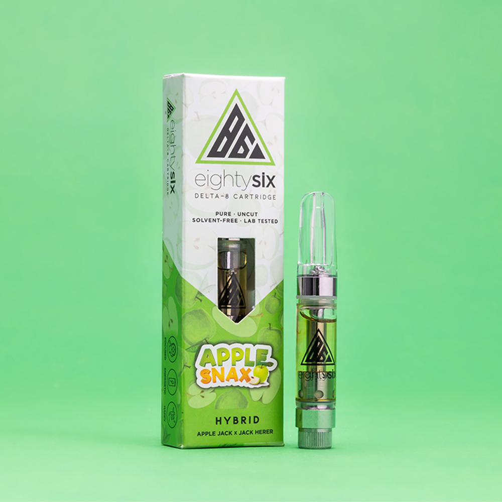 22 Apple Snax Delta-8 THC Vape Cartridge with its respective box on a green background.