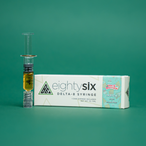 Jen & Berry's Delta-8 THC Syringe with its respective box on a green background.