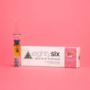 Cereal Killer Delta-8 THC Syringe with its respective box on a pink background.