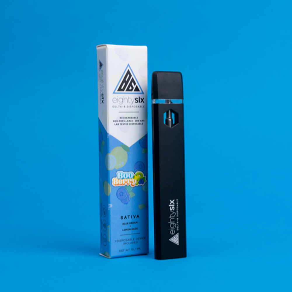 3 Boo Berry Delta-8 THC Disposable with its respective box on a blue background.