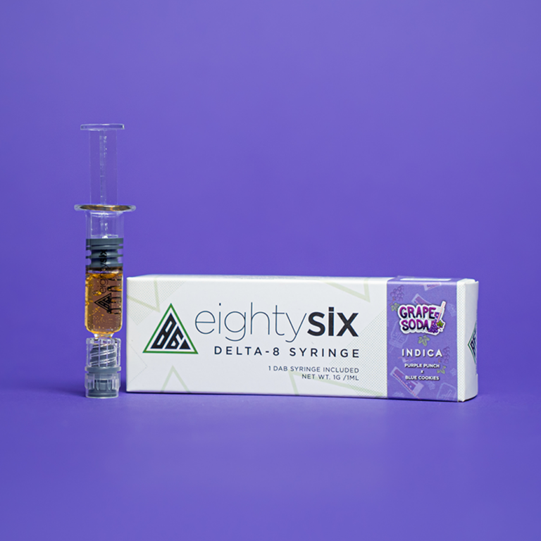 Grape Soda Delta-8 THC Syringe with its respective box on a purple background.