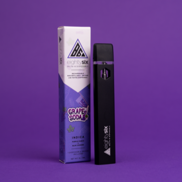 Grape Soda Delta-8 THC Disposable with its respective box on a purple background.