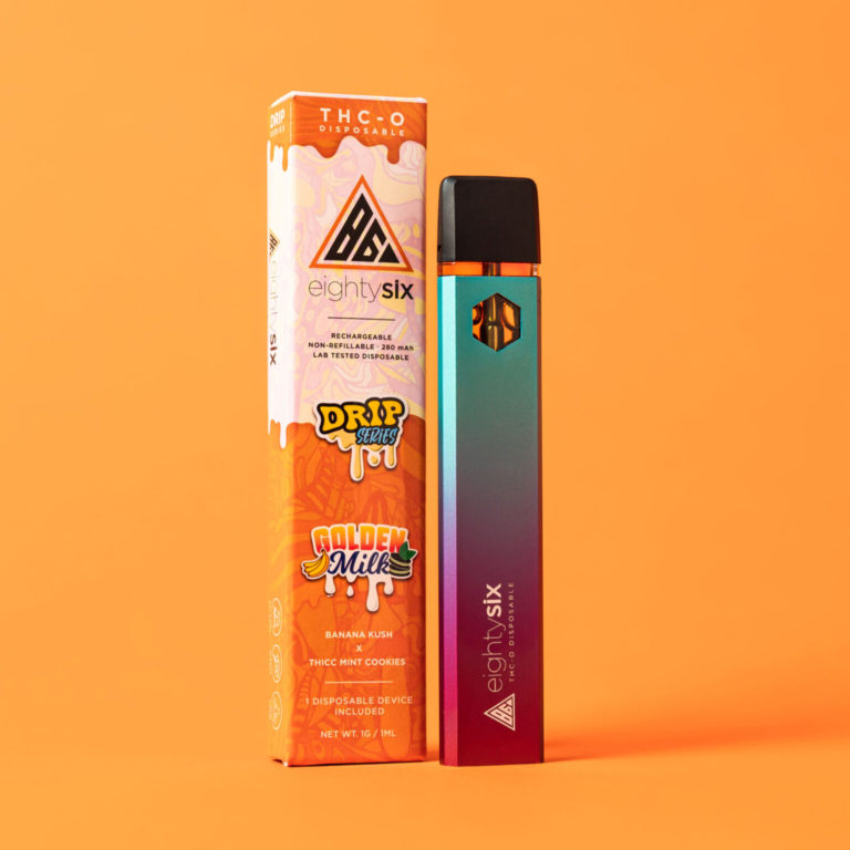 Golden Milk THC-O Disposable with its respective box on an orange background.