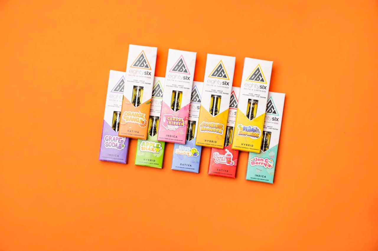 Full collection of Delta-8 vape flavors on an orange background