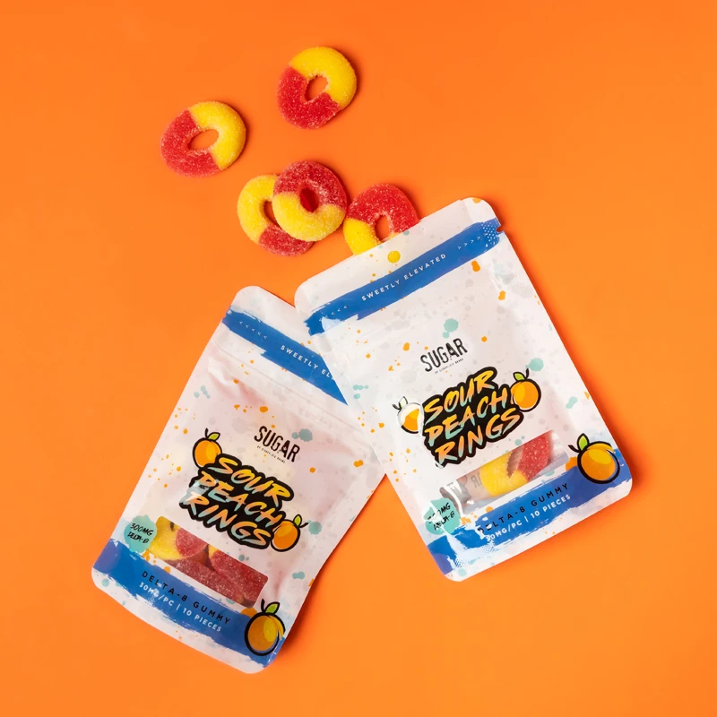 Delta-8 Chamoy Peach Rings on an orange background